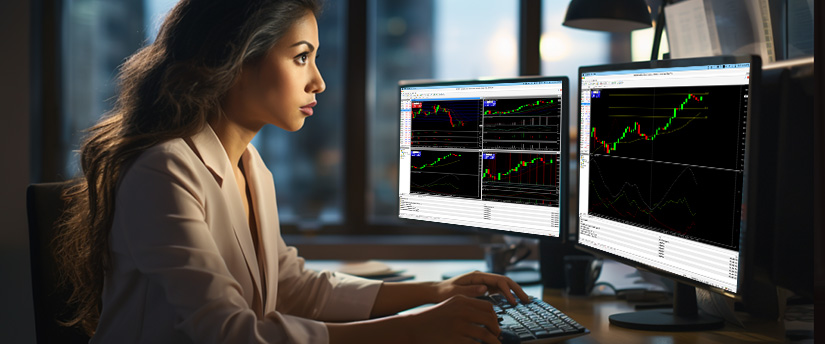 Female forex trader analyzing USD/NOK charts on dual monitors