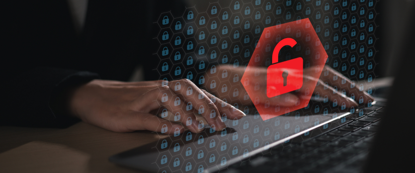 A person typing on a laptop with a padlock icon, symbolizing data protection by IronFX.