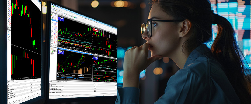 Person analyzing financial graphs and trading charts on multiple computer screens in a modern workspace, illustrating smart trading plan results.